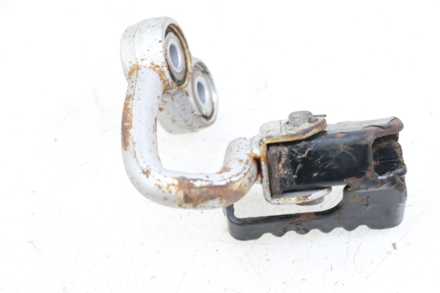 photo de Vorderes rechtes Fußrastenblech HYOSUNG XRX 125 (2000 - 2008) - Zoom auf Gebrauchszustand